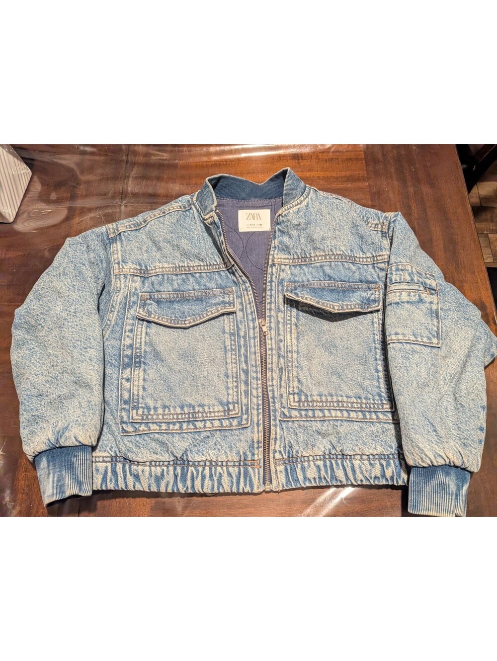 Zara acid-wash denim bomber jacket dual front pockets, zip-up, ribbed knit trim.